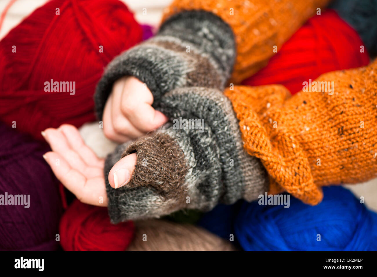 Man putting on fingerless gloves Stock Photo