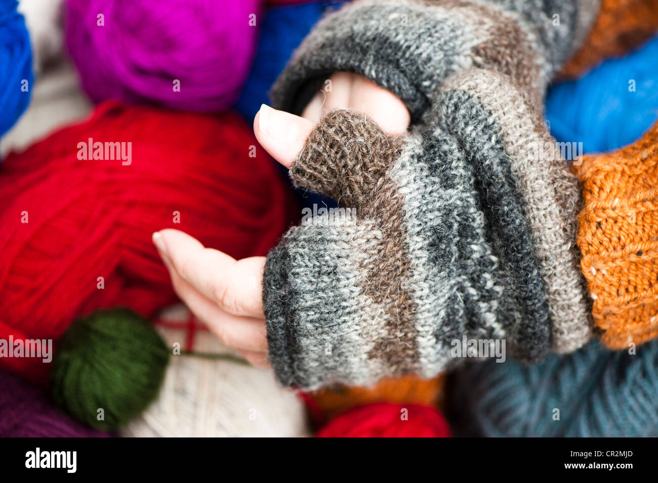 Man putting on fingerless gloves Stock Photo Alamy