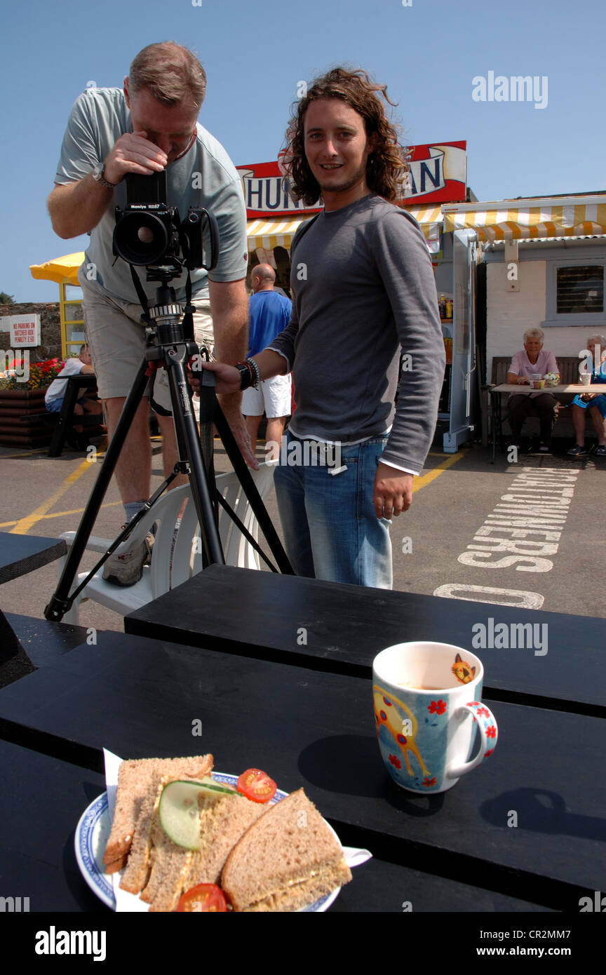 Professional photographers photographing a crab sandwich and mug of tea at the Hungry Man cafe, Rozel Bay, Jersey Stock Photo