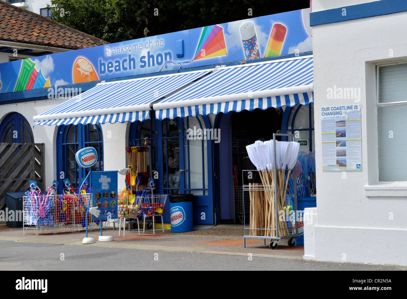 Beach shop at Branksome Chine beach, Poole, Dorset, on a windy and showery day in June. Stock Photo