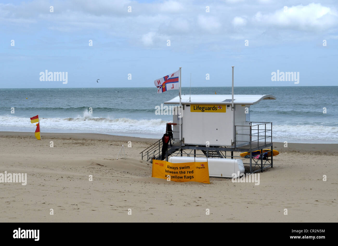 Lifeguard station at Branksome Chine beach, Poole, Dorset, on a windy and showery day in June. Stock Photo