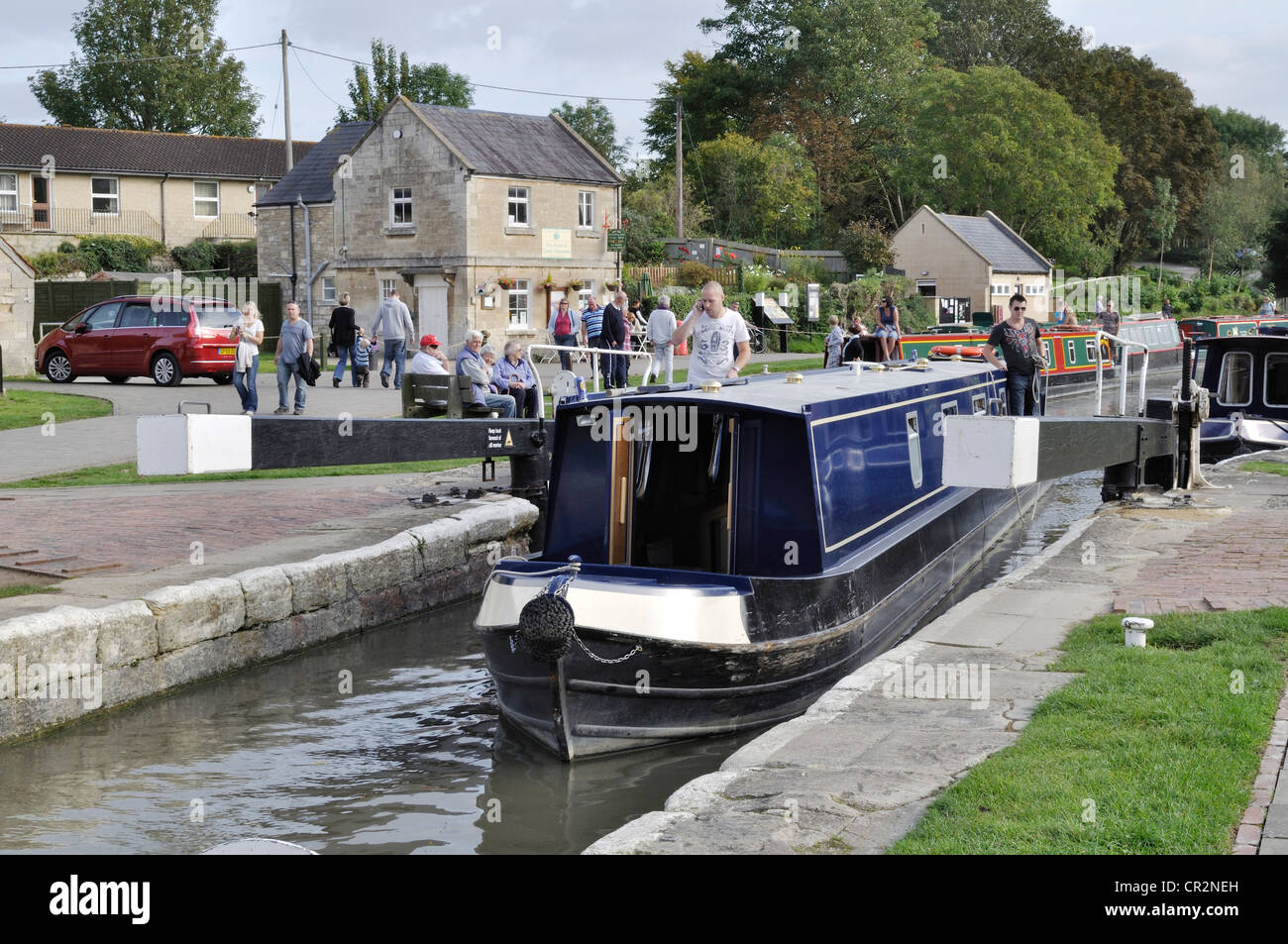 A narrowboat enters Bradford on Avon lock on the Kennet and Avon Canal. Stock Photo