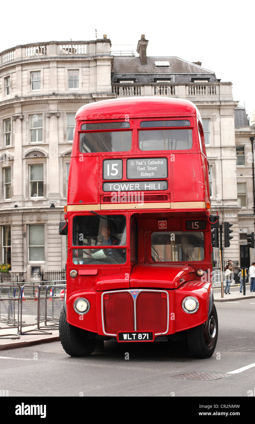 A red Routemaster bus on a London street. Stock Photo
