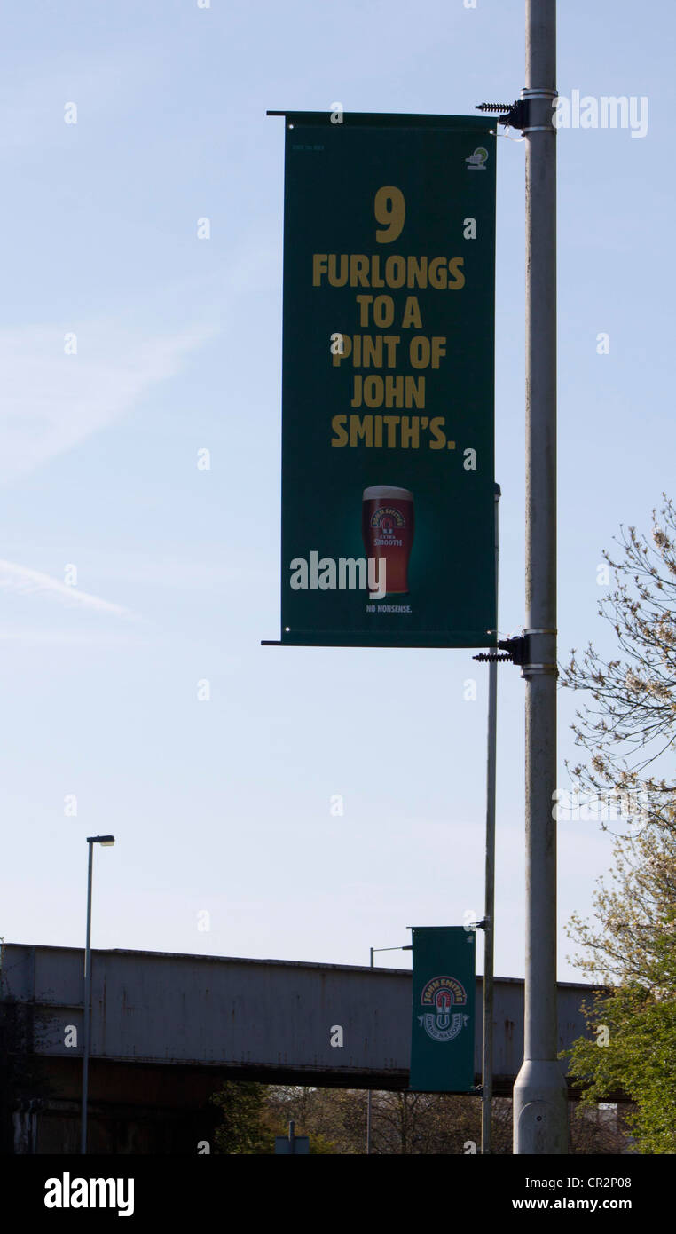 Aintree April, John Smiths Advert banner Stock Photo