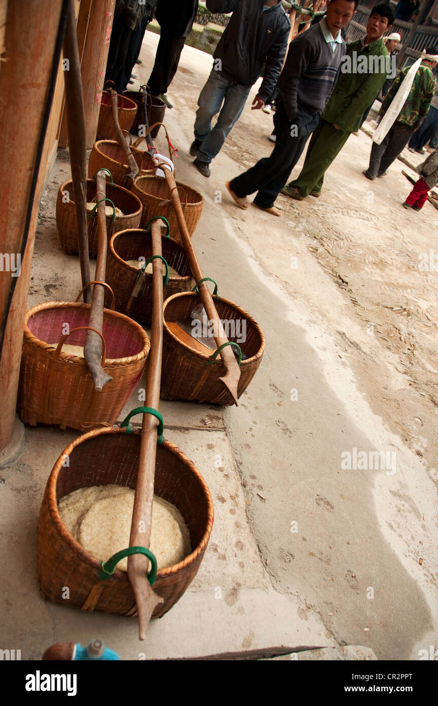 Baskets carriers on the pavement, Zhaoxing Dong Village, Southern China Stock Photo