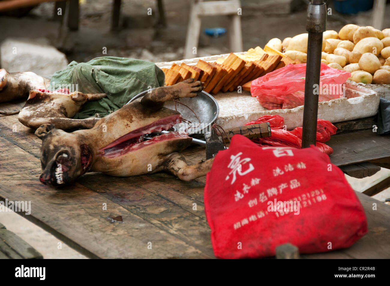 Dog meat and tofu on sale on a market stall, Zhaoxing Dong Village, Southern China Stock Photo