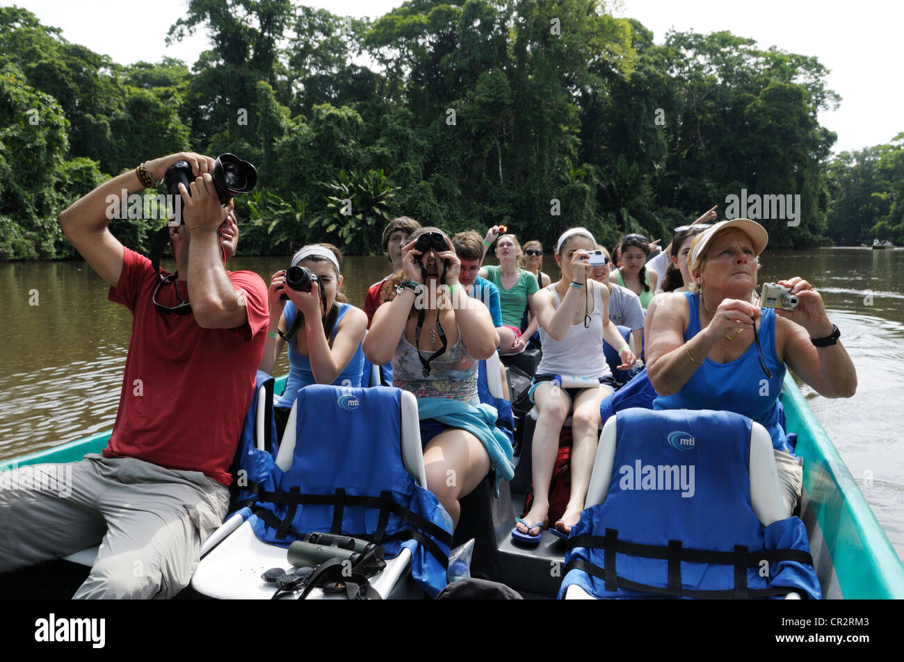 Ecotourists watching wildlife, Tortuguero National Park, Costa Rica Stock Photo