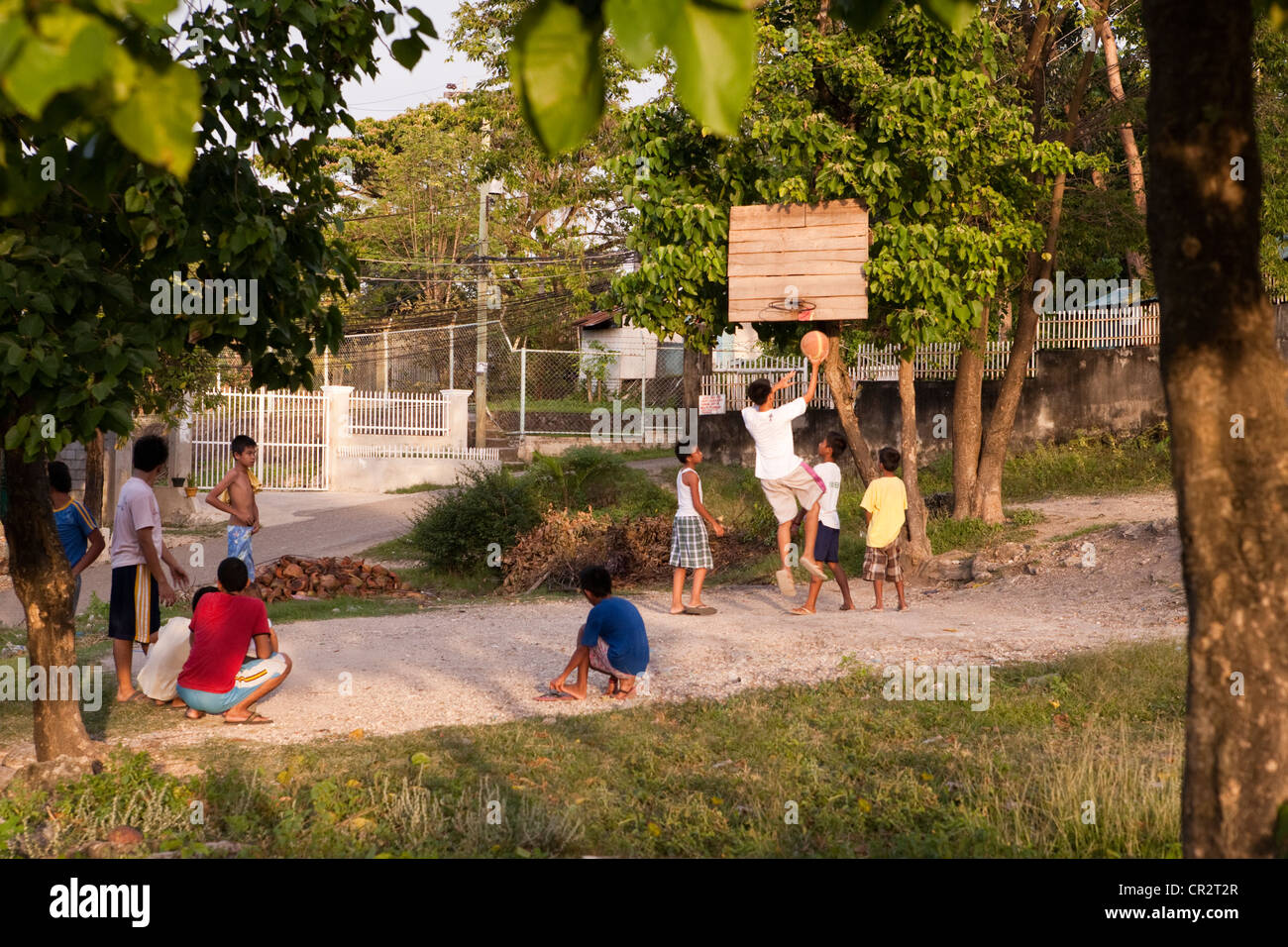 Filipino boys playing basketball. Lapu-Lapu City, Metro Cebu, Mactan Island, Visayas, Philippines. Stock Photo