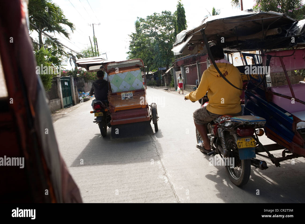 Tricycles, a form of public transport. Lapu-Lapu City, Metro Cebu, Mactan Island, Visayas, Philippines. Stock Photo