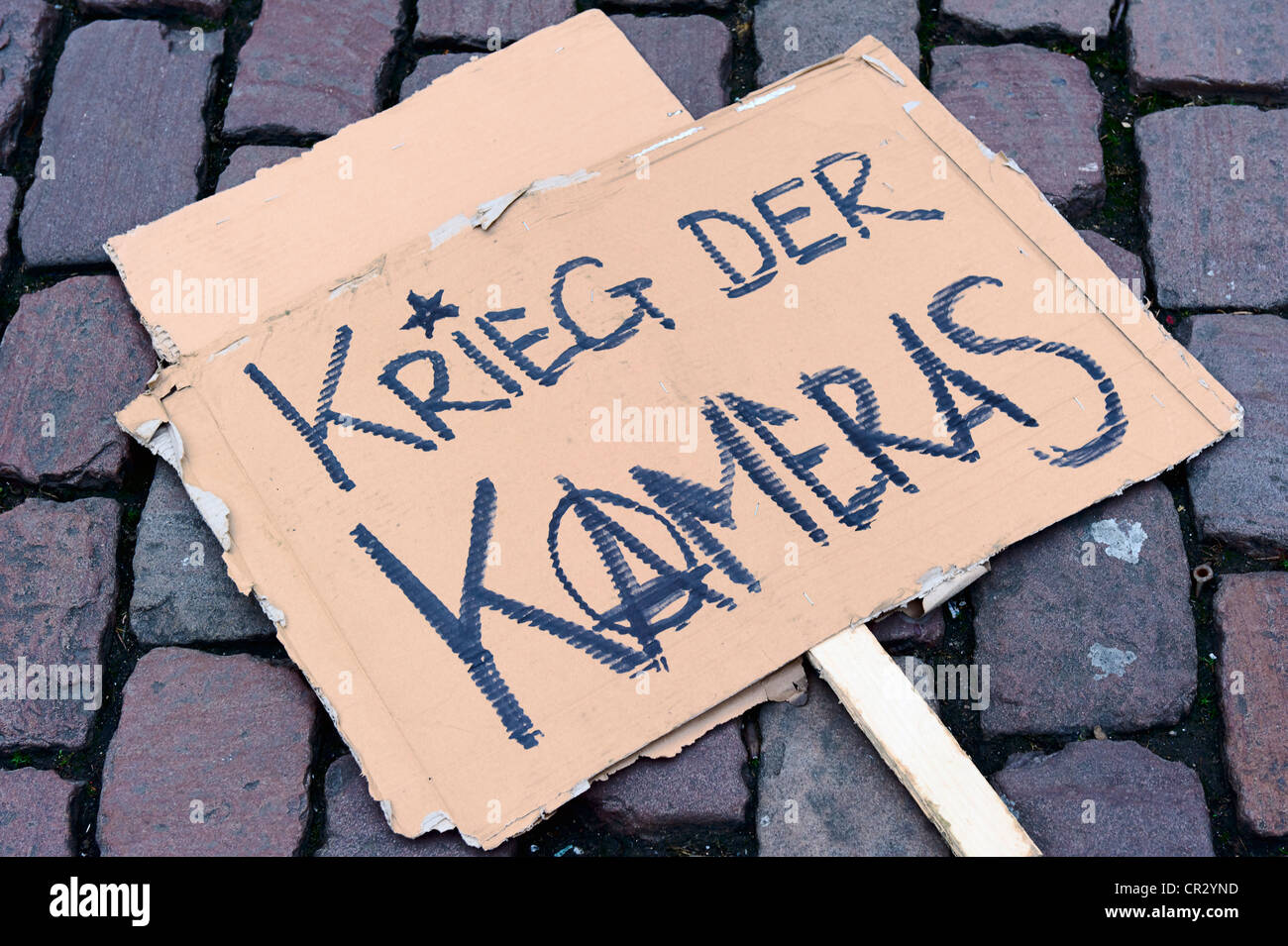 Sign, Krieg der Kameras, German for War of the cameras, protest against the use of surveillance video, demonstration against the Stock Photo