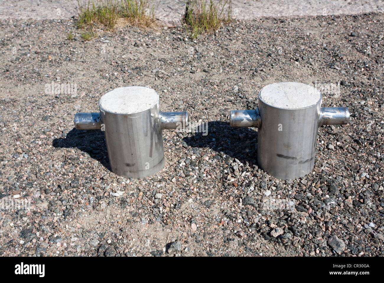 two steel bollards in harbour Stock Photo
