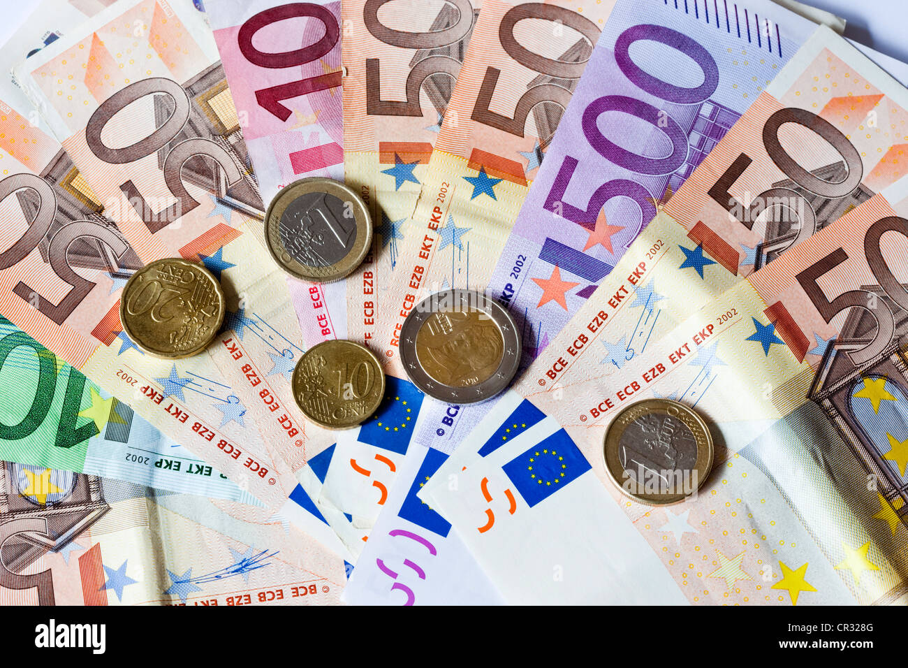 Banknotes and coins in euros Stock Photo
