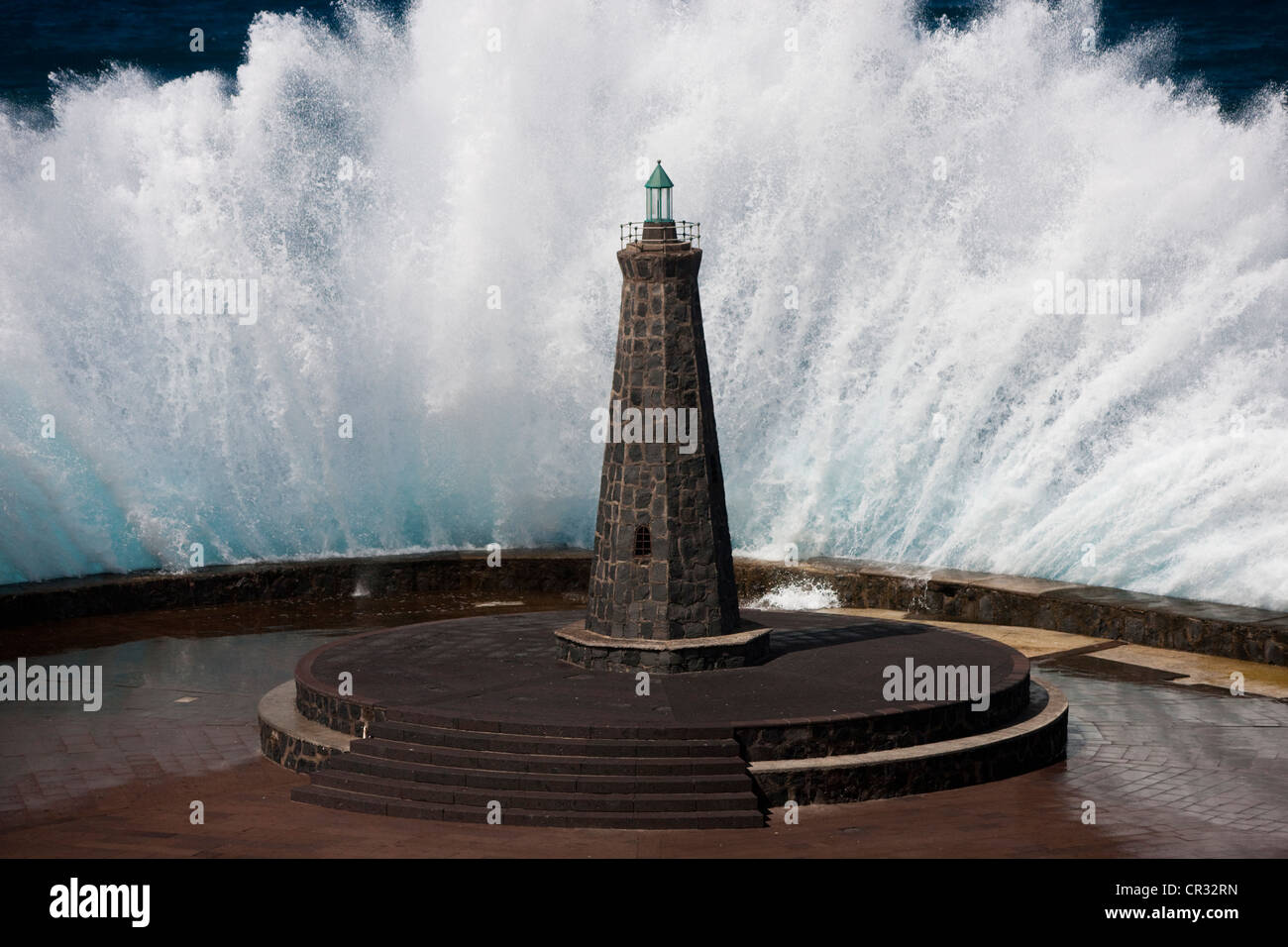 Waves behind a lighthouse on the Atlantic in Bajamar, Tenerife, Spain, Europe Stock Photo