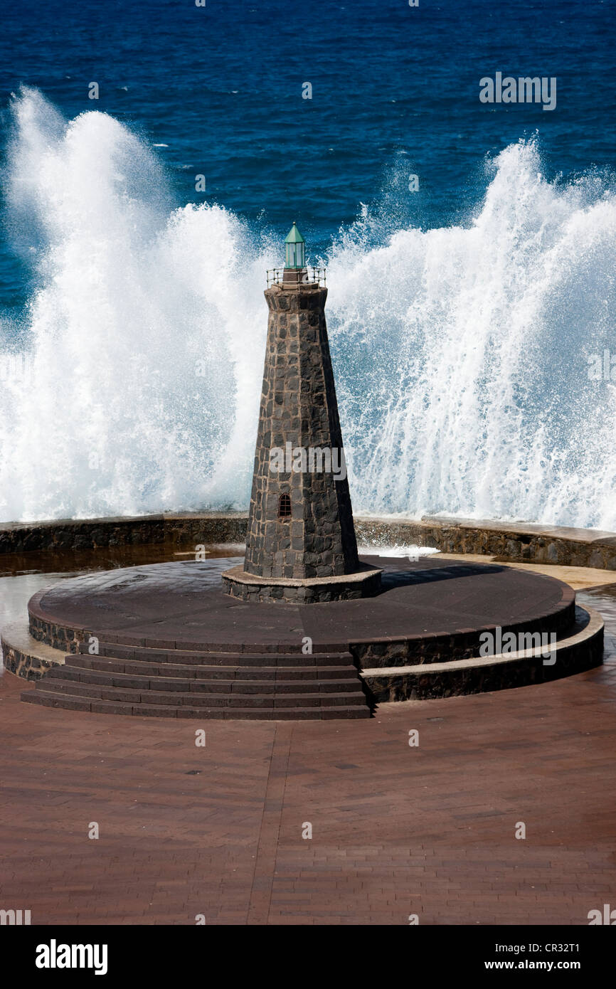Waves behind a lighthouse on the Atlantic in Bajamar, Tenerife, Spain, Europe Stock Photo