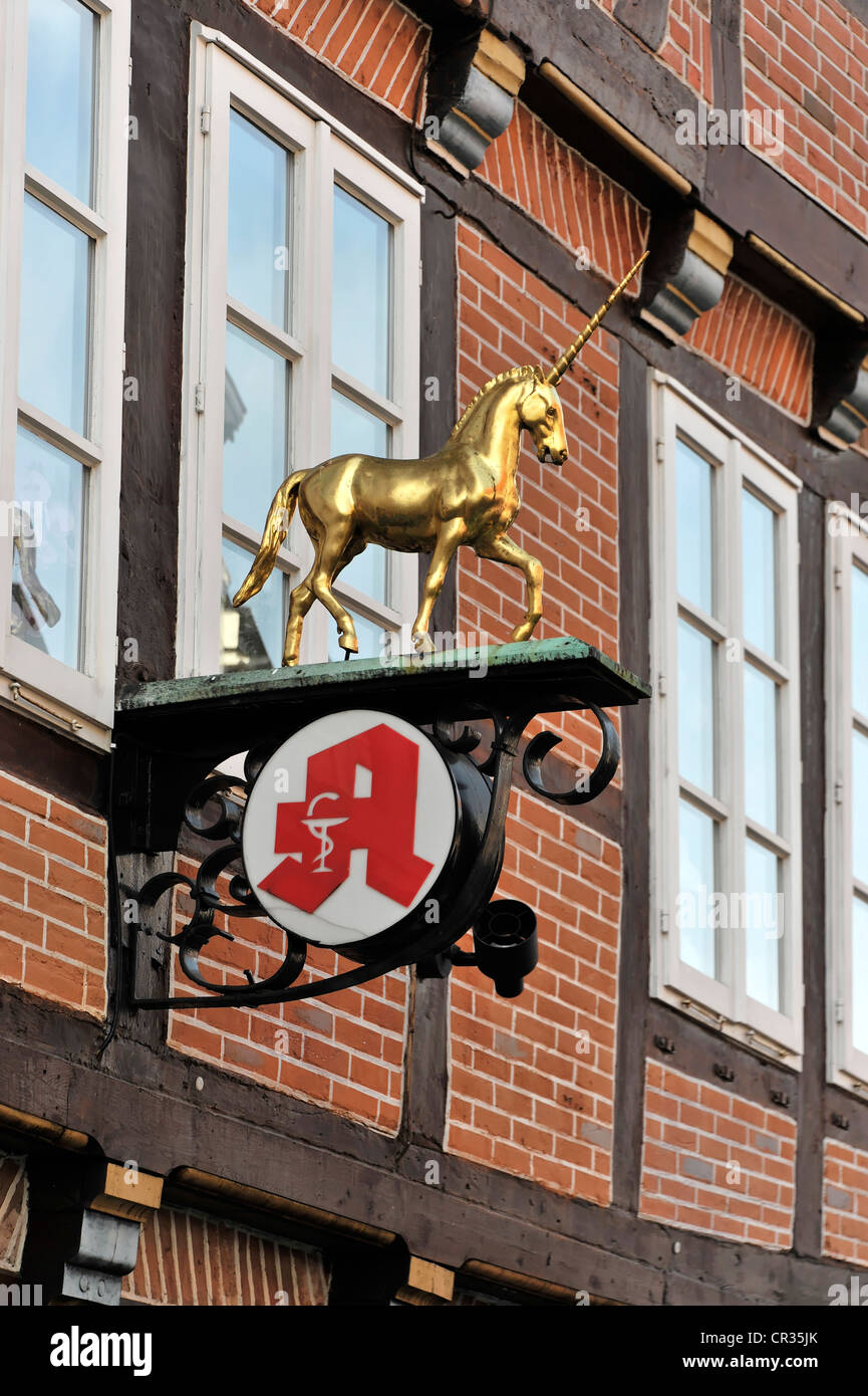 Unicorn statue above the entrance of the historic Einhorn Apotheke, Unicorn Pharmacy, Hanseatic town of Stade, Lower Saxony Stock Photo