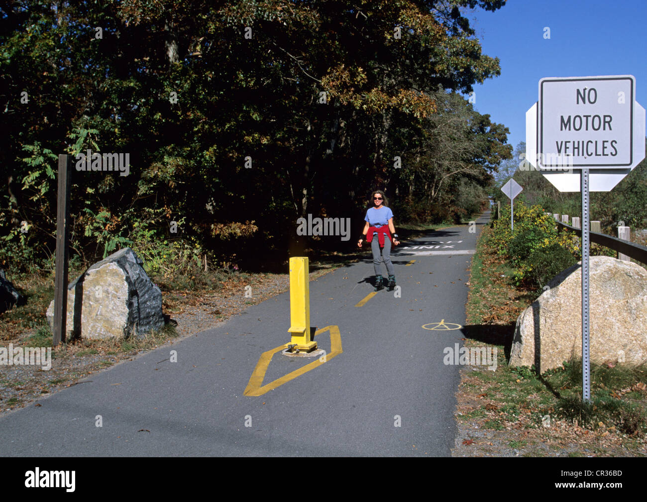 United States, Massachusetts, Cape Cod, bicycle path of the peninsula, woman roller skating Stock Photo