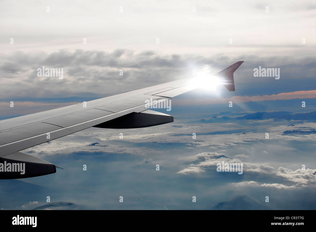 Right wing, Airbus A 319 in flight above clouds Stock Photo