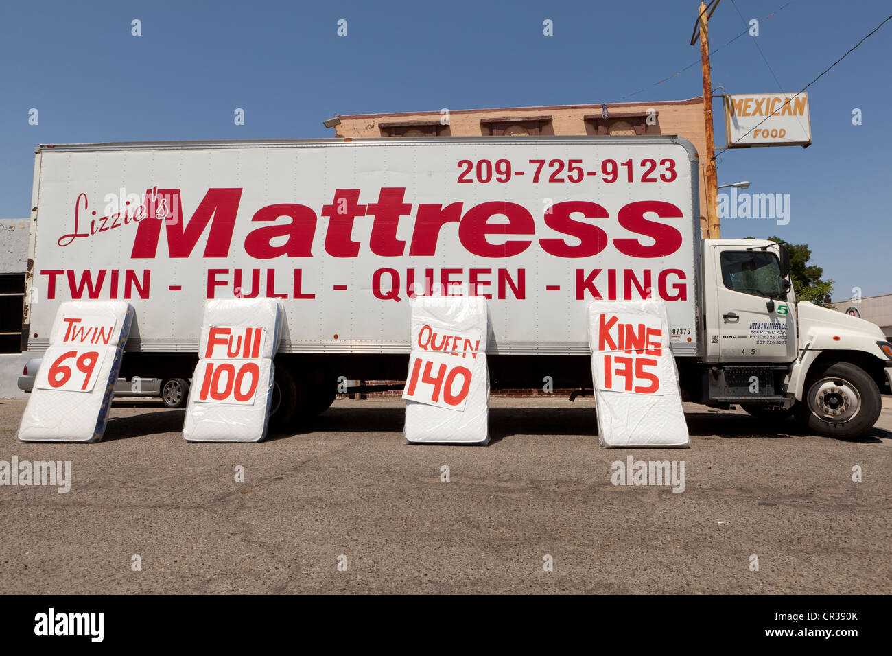 Mattress sale ad on truck Stock Photo