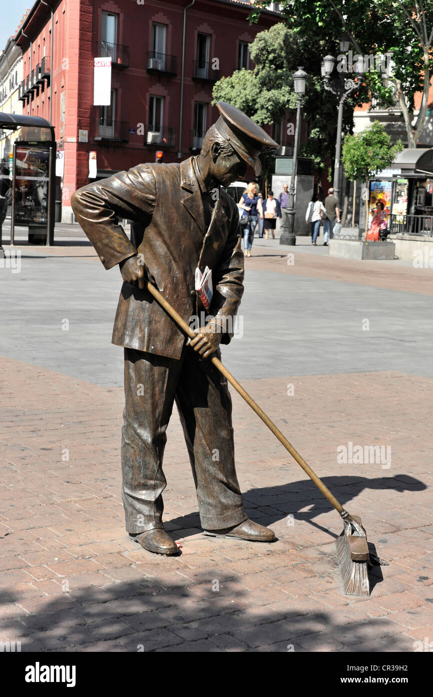 Street sweeper bronze sculpture, monument in honor of the Madrid street