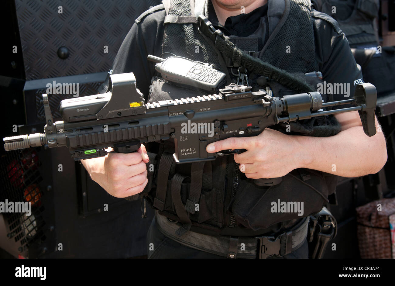 Police firearms officer armed with Heckler and Koch 416 C assault rifle based on the American M4. Stock Photo