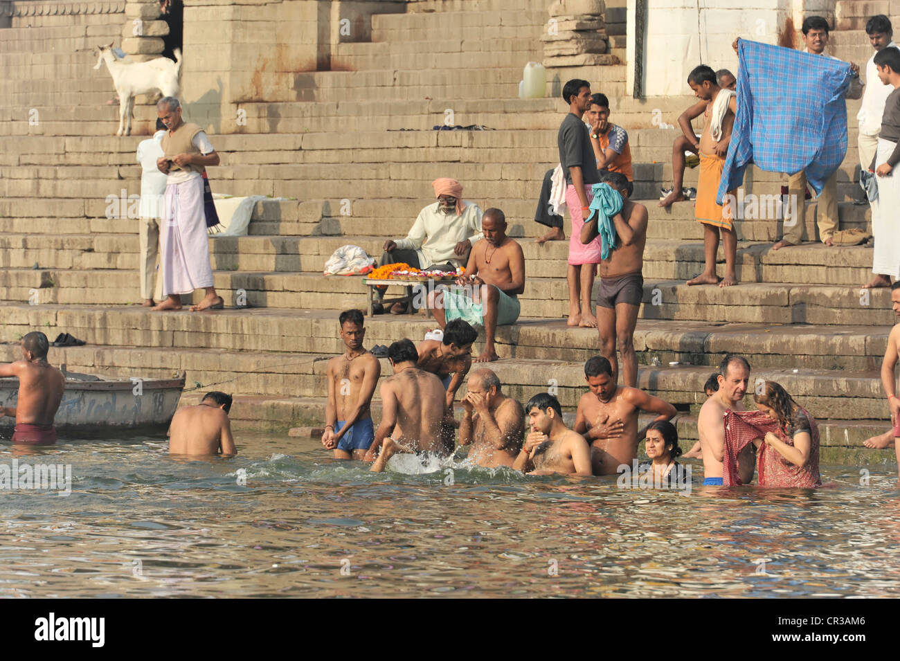 Believers during the ritual washing on the banks of the Ganges River in Varanasi, Benares, Uttar Pradesh, India, South Asia Stock Photo