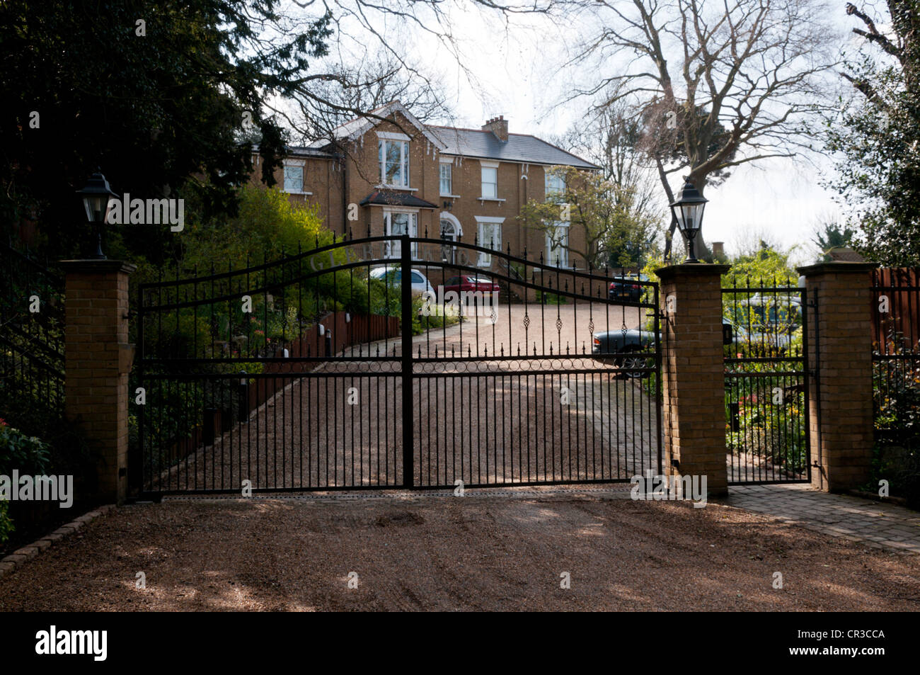 Entrance gates to a large old house re-developed as flats or apartments