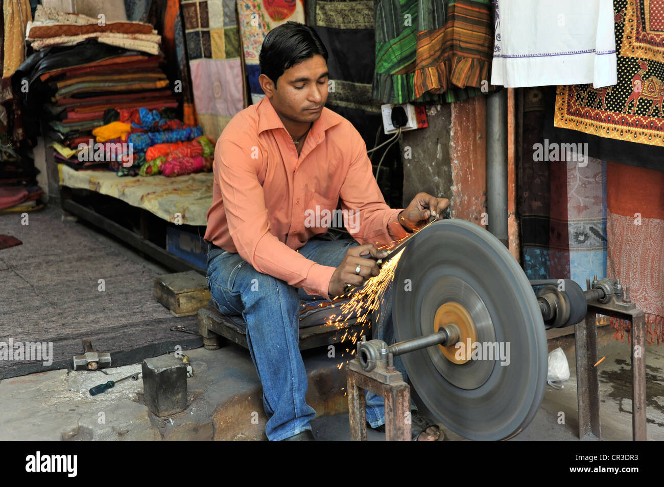 Manufacture of swords and daggers, knife grinder in Jaipur, Rajasthan, India, Asia Stock Photo