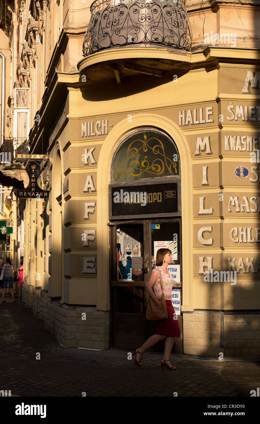 Refurbished inscriptions on a milk store in German and Polish, Lviv, Ukraine Stock Photo