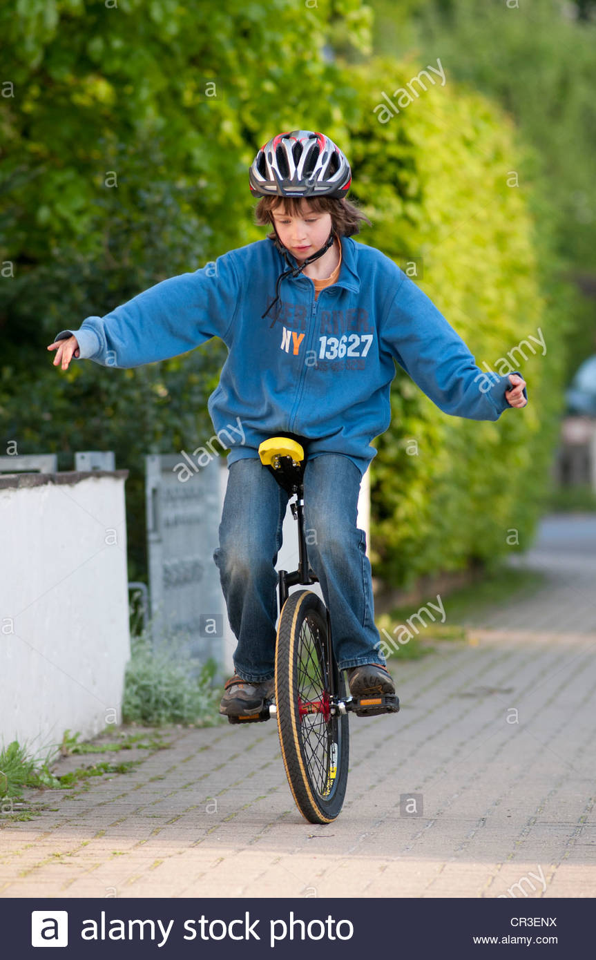Unicycle Child Stock Photos & Unicycle Child Stock Images Alamy