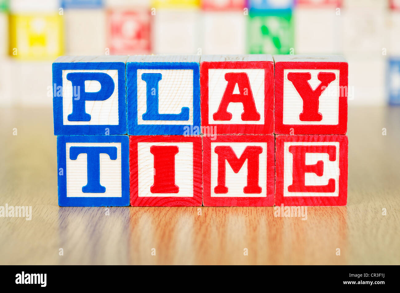 Playtime Spelled Out in Alphabet Building Blocks Stock Photo