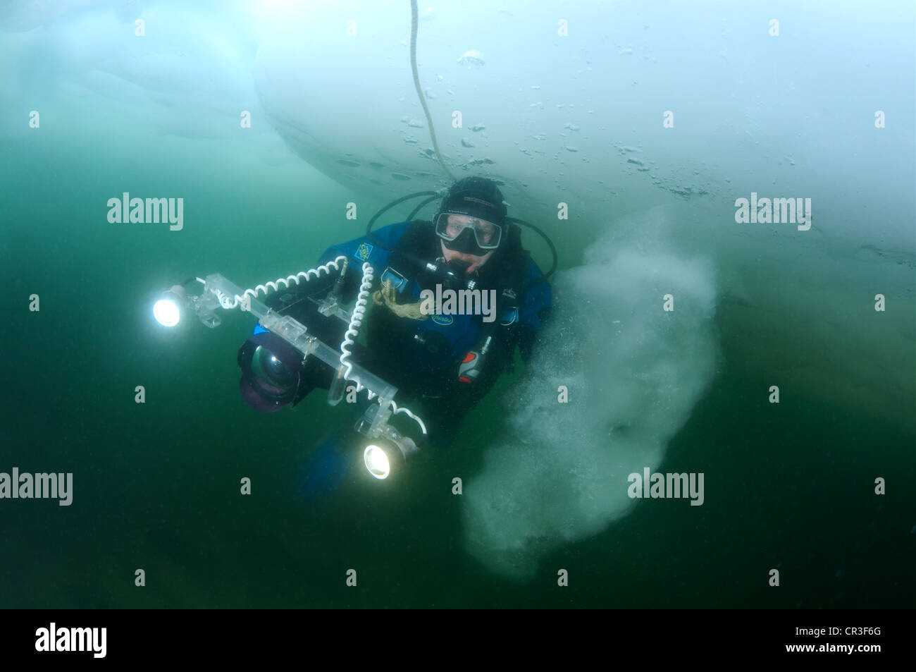 Diver, subglacial diving, ice diving, in the frozen Black Sea, a rare