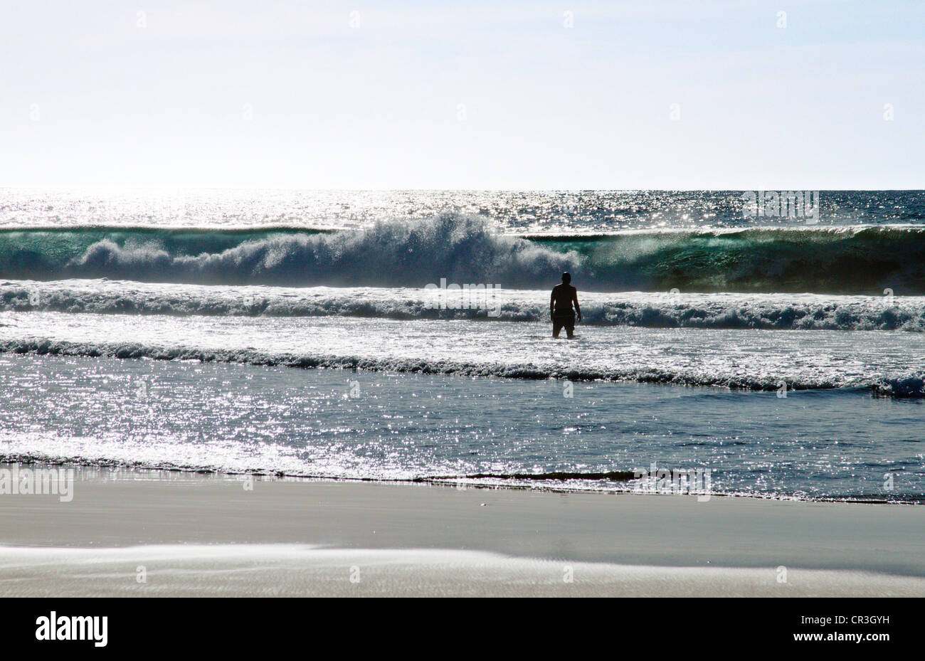 Silhouette of man in surf near "Todos Santos" Baja Mexico Stock Photo