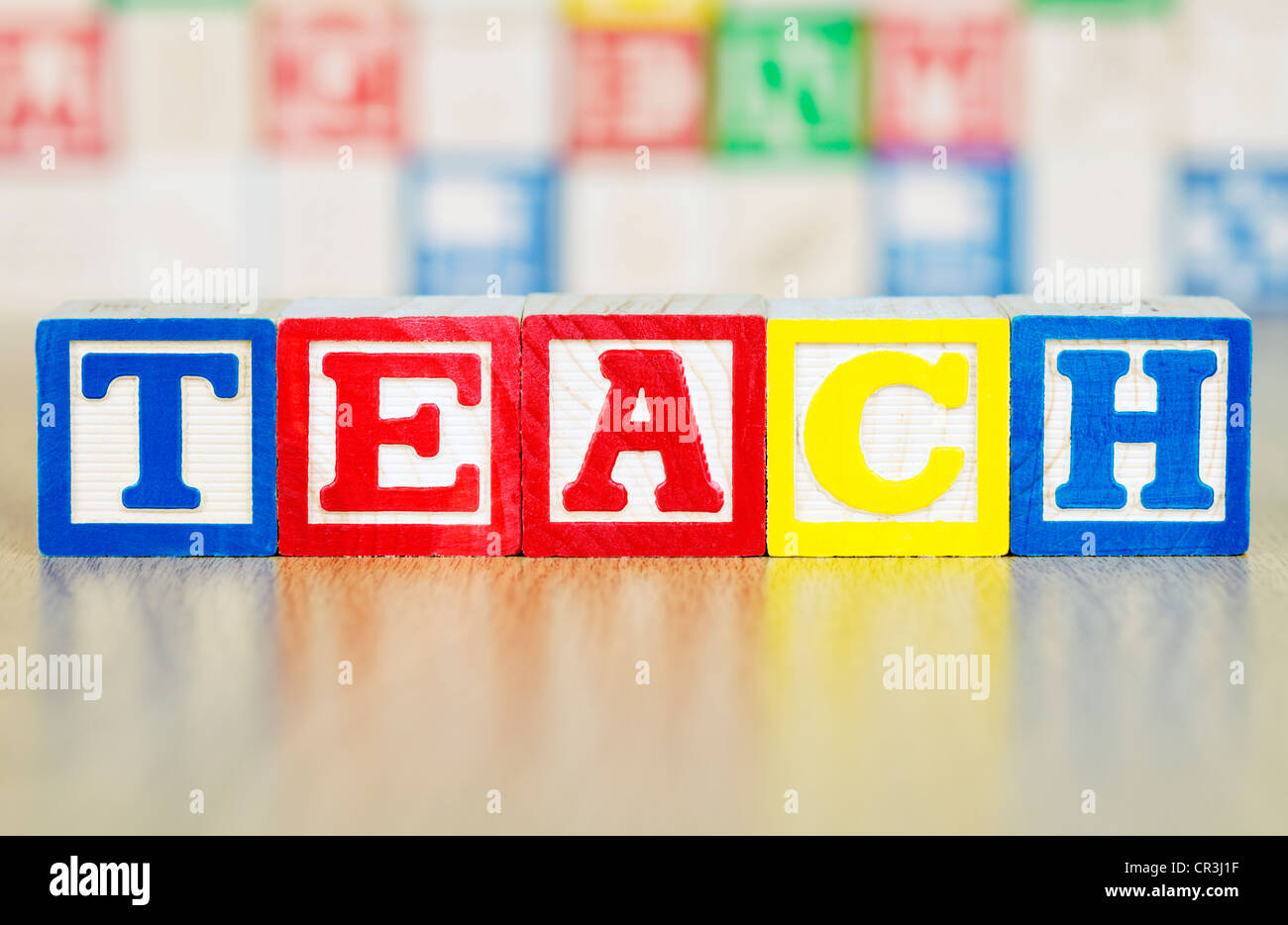 Teach Spelled Out in Alphabet Building Blocks Stock Photo