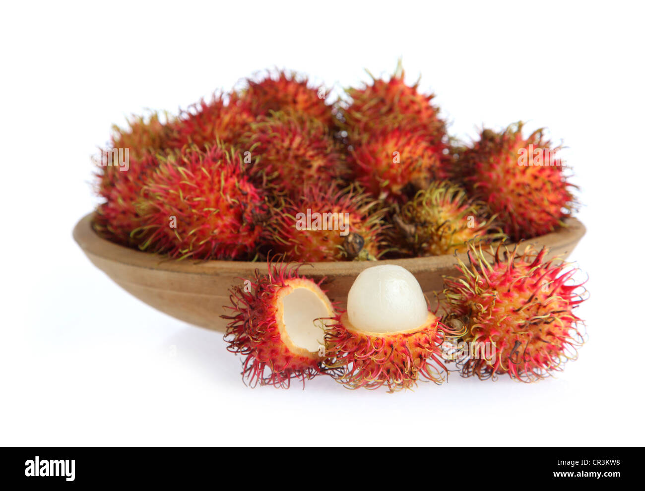 Bowl of Rambutan on white background Stock Photo