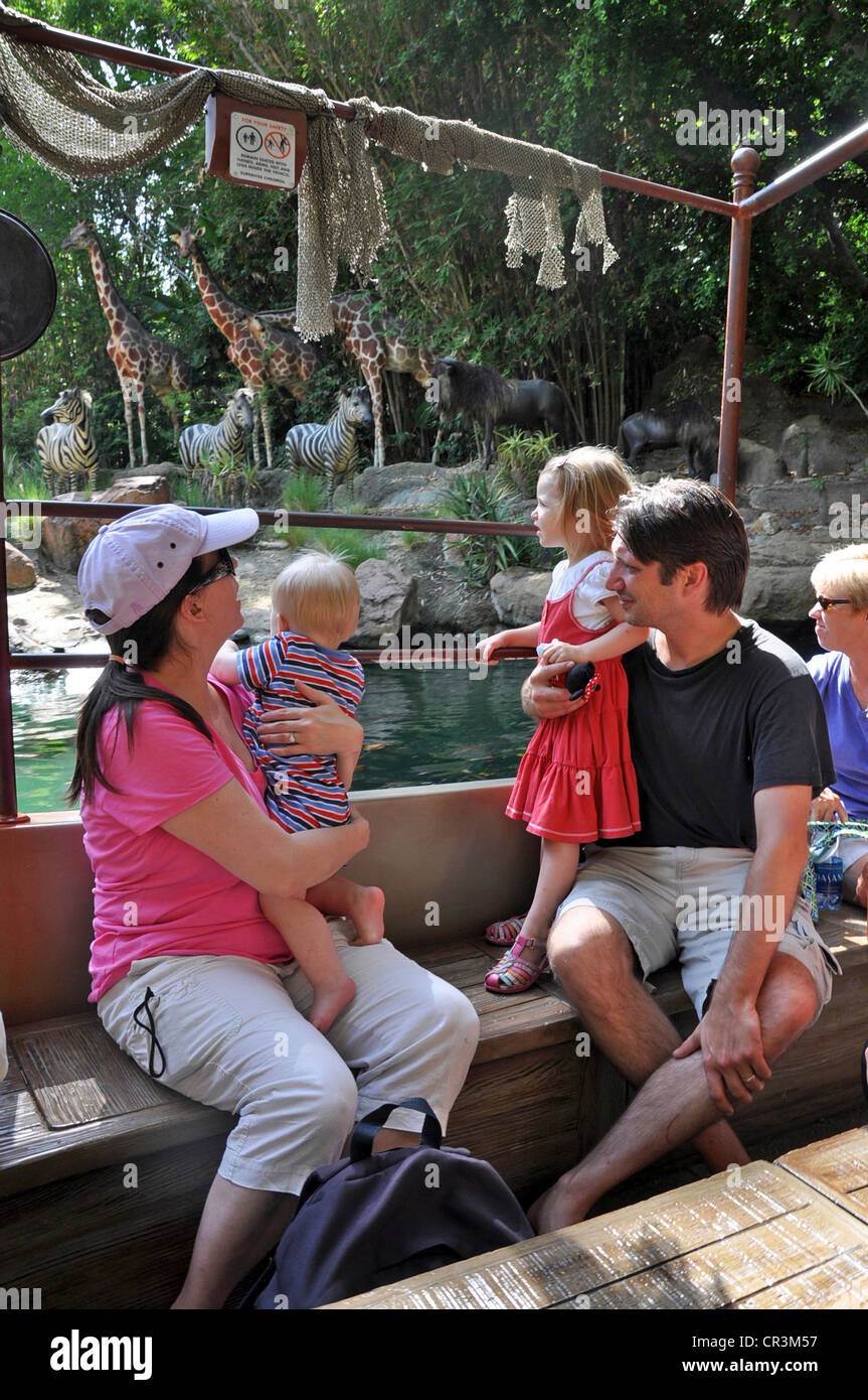 Families enjoy viewing wild animals on the Jungle River Cruise in Adventureland, Disneyland, Anaheim, California, USA Stock Photo