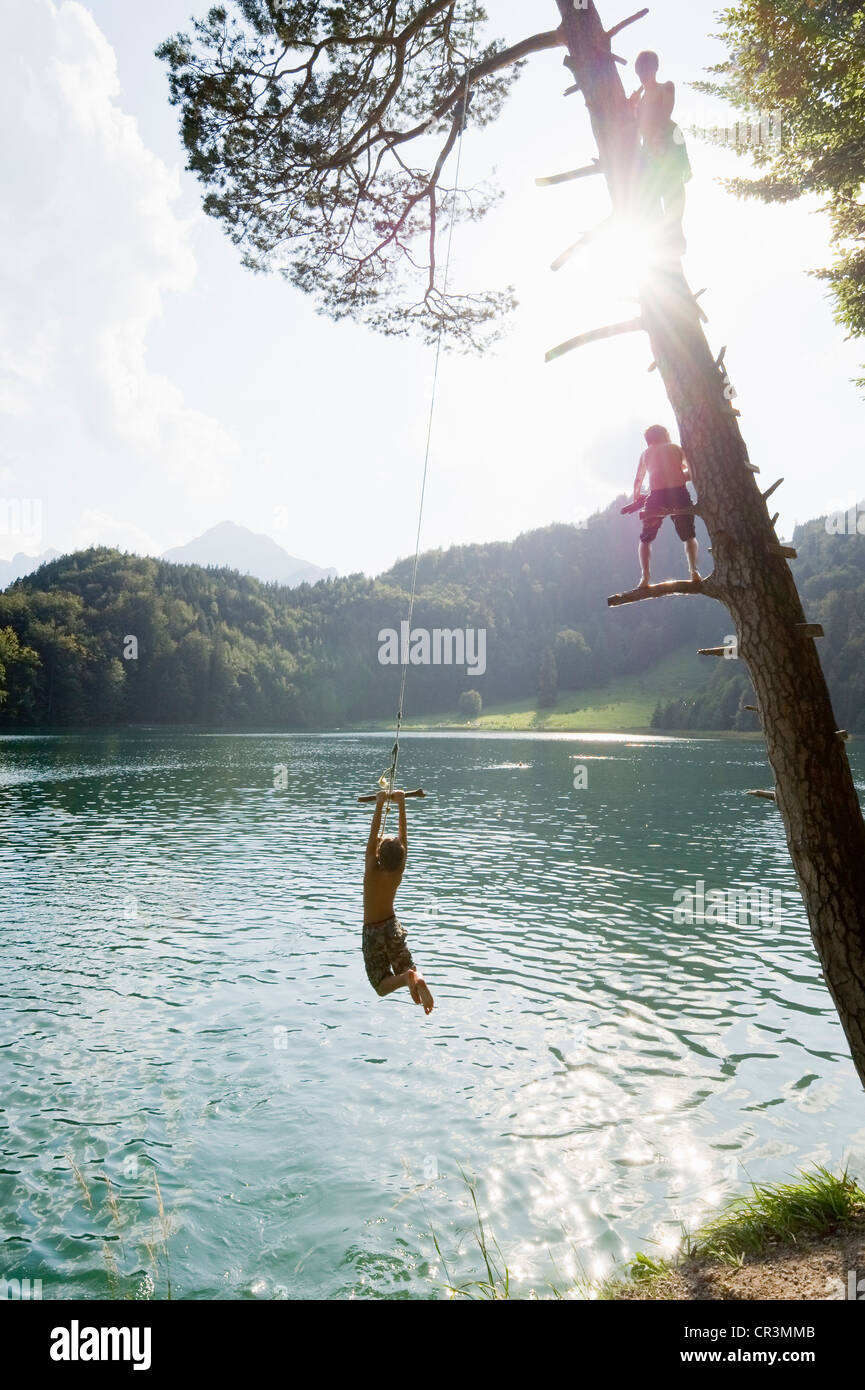 Children having fun on Lake Alatsee near Fuessen, Allgaeu region, Bavaria, Germany, Europe Stock Photo