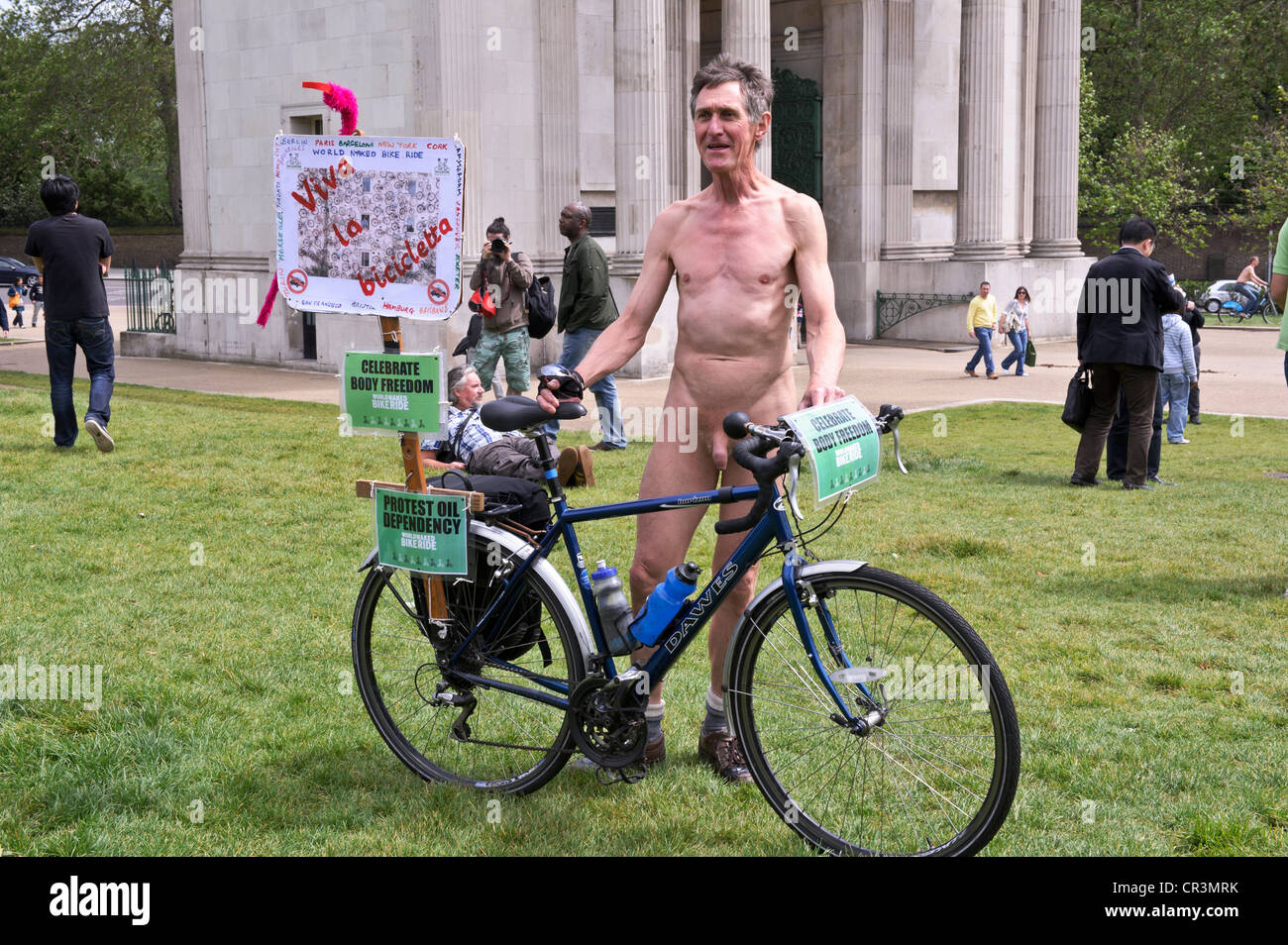 Man with push bike World Naked Bike Ride 2012 Wellington Arch