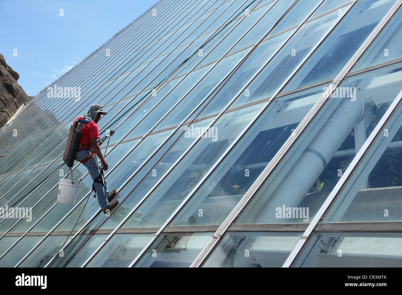 Window cleaner on Moody Gardens pyramid, Galveston Texas Stock Photo