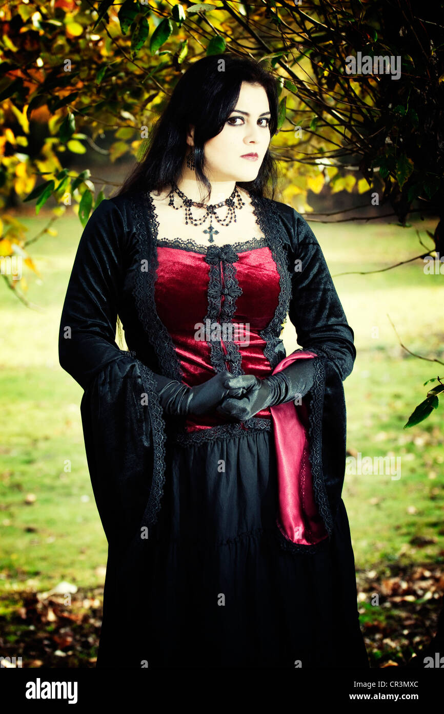 Woman, dressed in a Gothic style, Romantic-Gothic, standing, looking serious Stock Photo