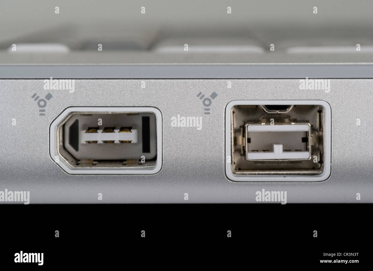 Firewire 400 and 800 ports on a notebook computer Stock Photo