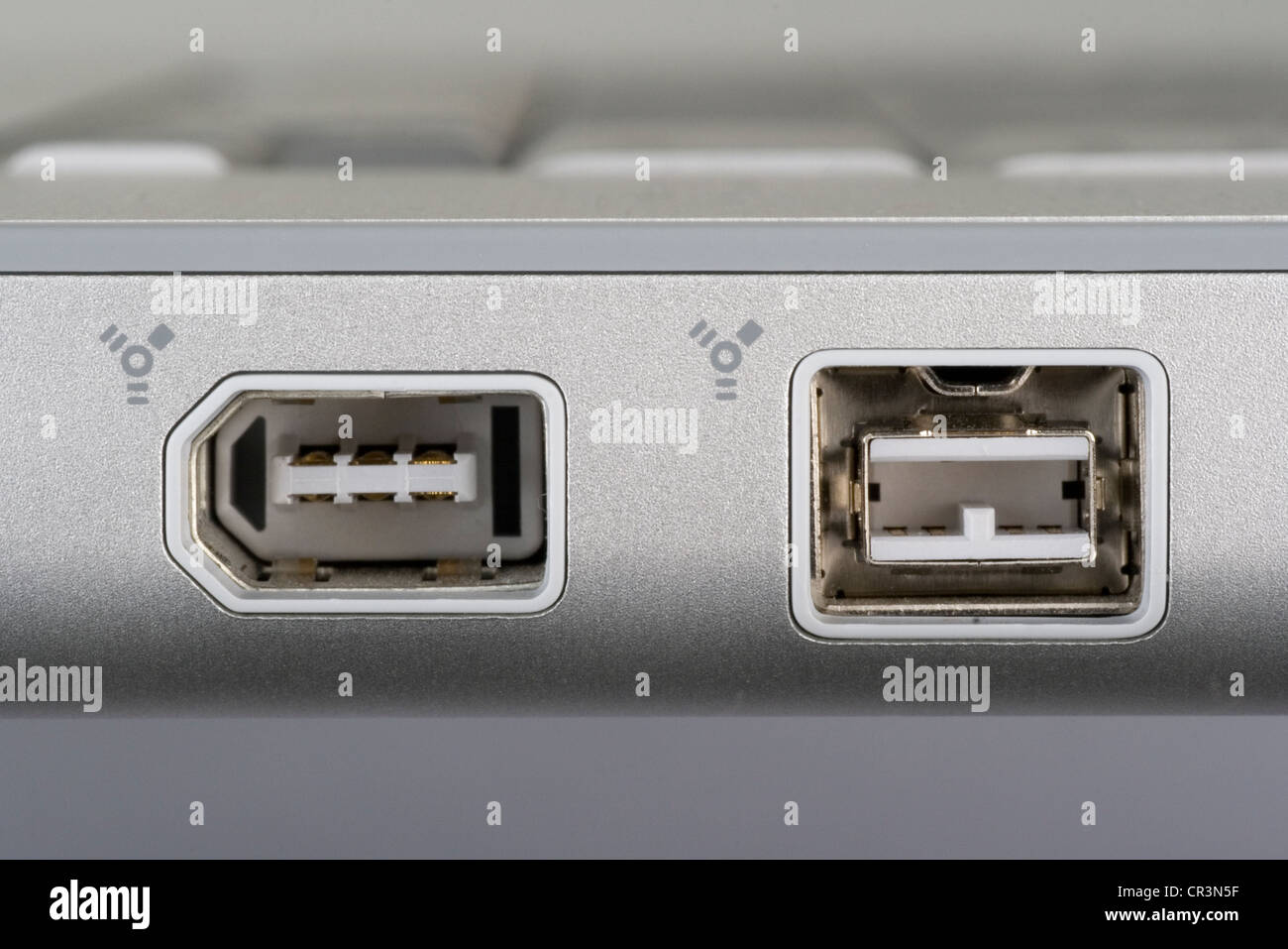 Firewire 400 and 800 ports on a notebook computer Stock Photo