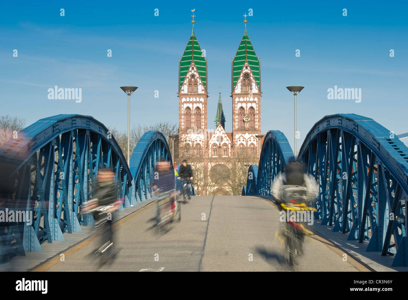 Cyclists, motion blur, Blaue Bruecke bridge, Freiburg im Breisgau, Baden-Wuerttemberg, Germany, Europe Stock Photo