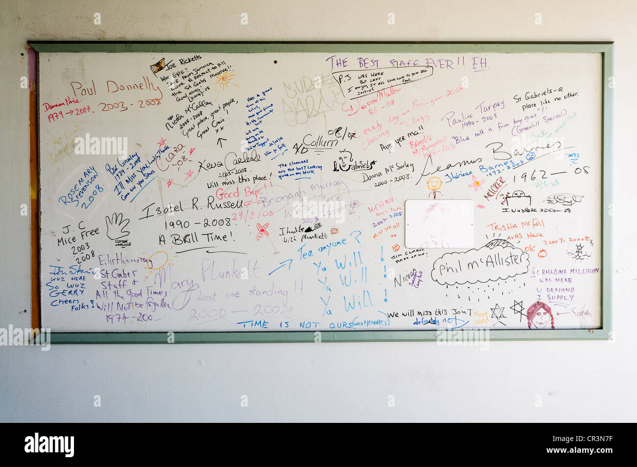 Messages left by pupils for staff and teachers on a whiteboard in school which has been closed for good due to budget cuts Stock Photo