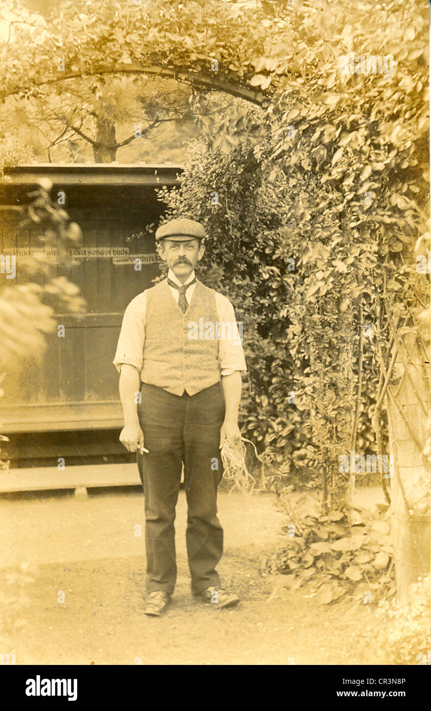 Portrait postcard of working gardener Stock Photo