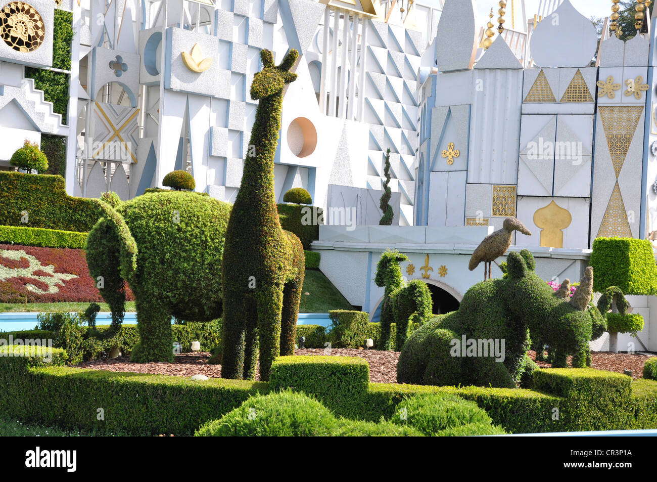 Disneyland's fanciful and enchanting 'It's a Small World' attraction with animal topiary in sunny Anaheim, California Stock Photo