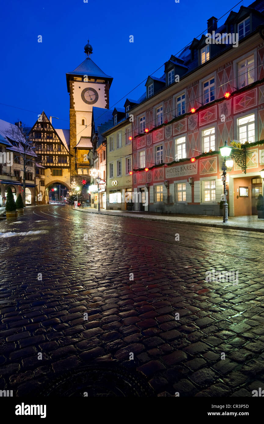 Wintery old town with Schwabentor city gate at Christmas time, Freiburg im Breisgau, Baden-Wuerttemberg, Germany, Europe Stock Photo