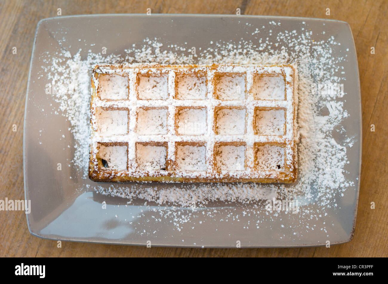 Waffle with icing sugar on a plate Stock Photo