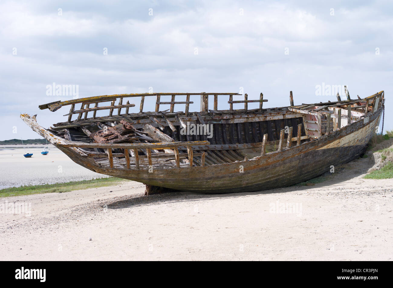 Wreck, wooden boat stranded on the beach Stock Photo