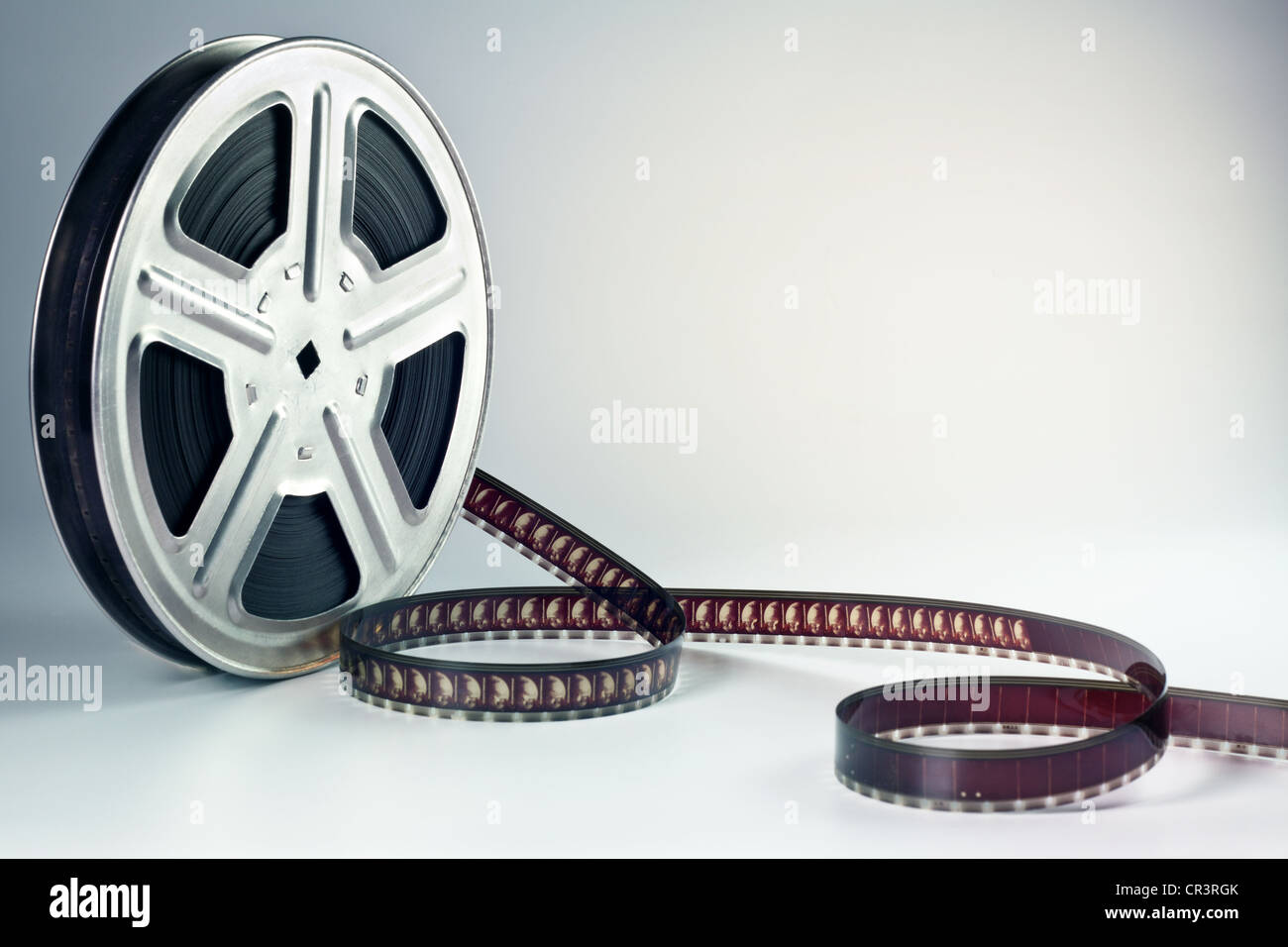 Film reel with film ribbon Stock Photo - Alamy