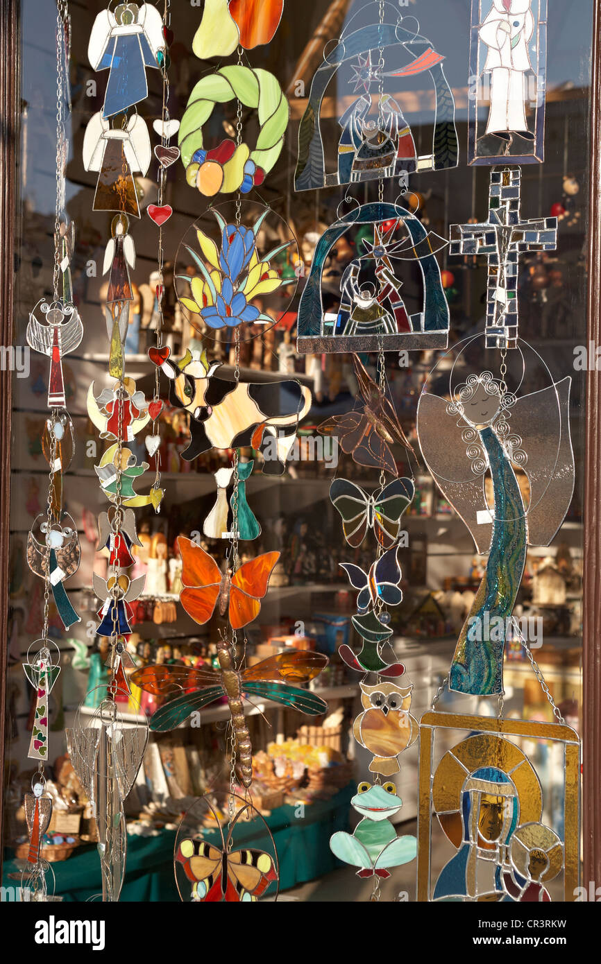 Eastern Europe Poland Krakow Stained glass souvenirs hanging in shop window on Rynek Glowny main Square Stock Photo